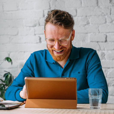 Happy individual looking at screen