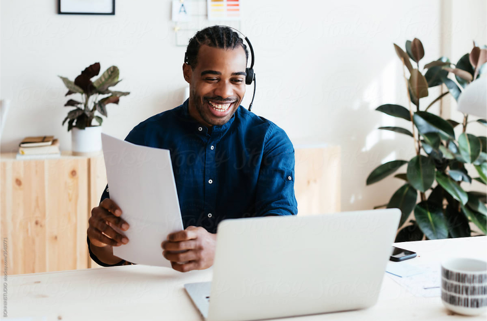 happy guy on video call with notebook