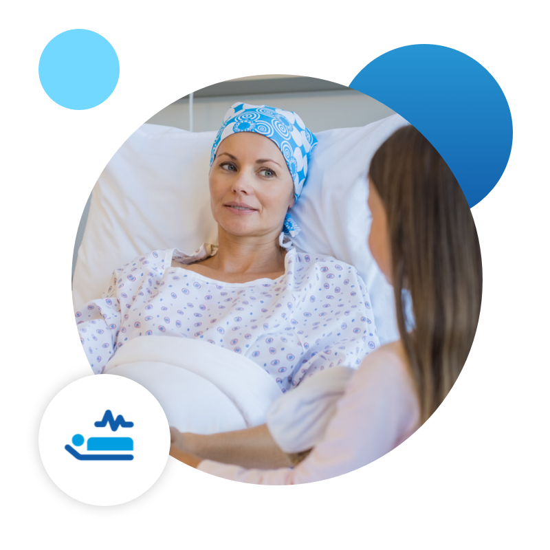 An image of a mother in a hospital bed talking with her daughter.